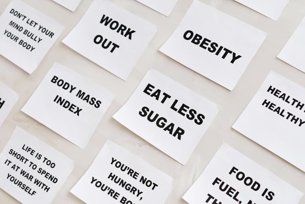 A calm arrangement of wellness reminder cards on a soft surface